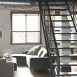 gray couch beside window