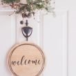 brown wooden welcome wall decor